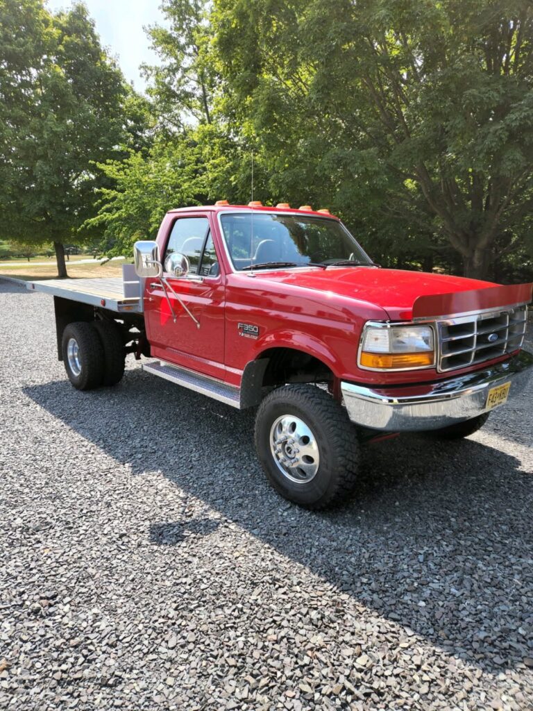 Heavy duty red truck equipment used for home renovation material delivery